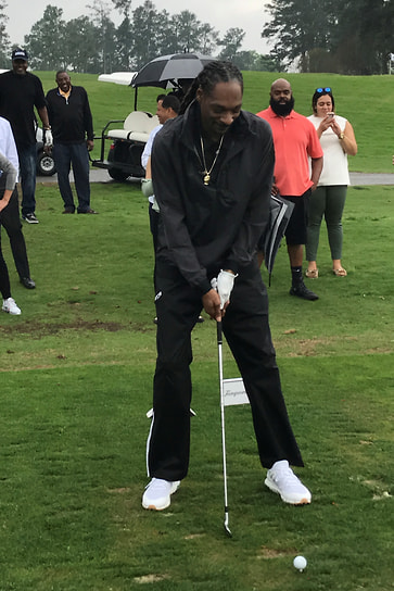 Рэпер во время игры в гольф в Огасте, штат Джорджия, 2017 год